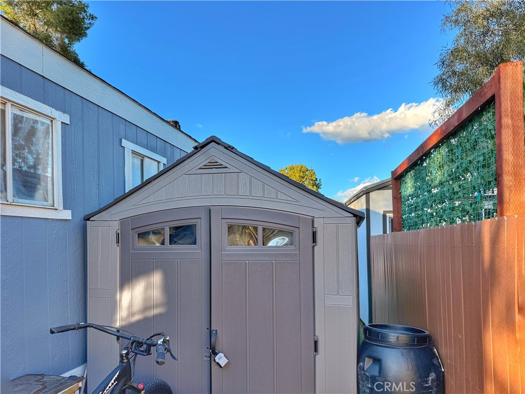 14925 Great Overland Stage Route, Unit A13 Julian, CA 92036 - Photo 3 of 19 a view of a small house with roof deck