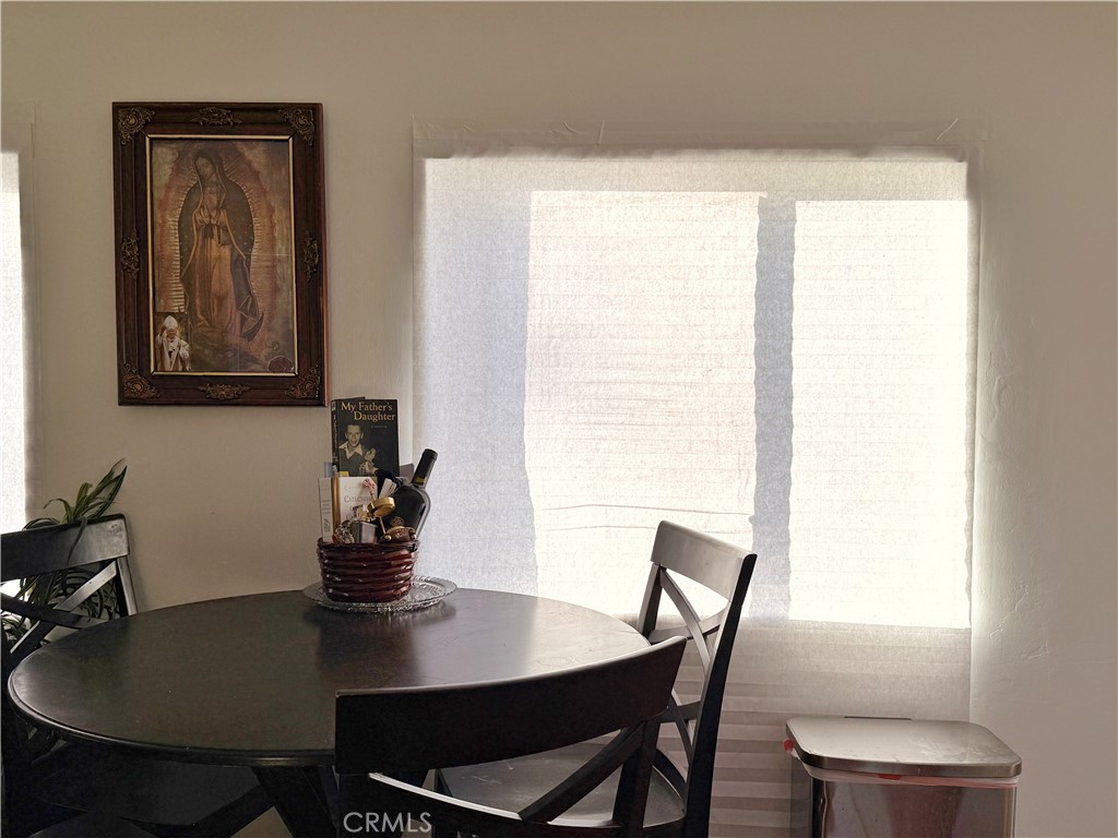 14925 Great Overland Stage Route, Unit A13 Julian, CA 92036 - Photo 4 of 19 a view of a dining room with furniture and window
