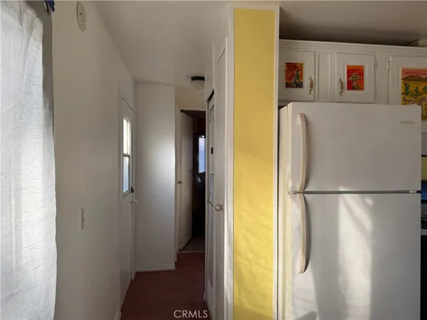 a white refrigerator freezer and a dishwasher