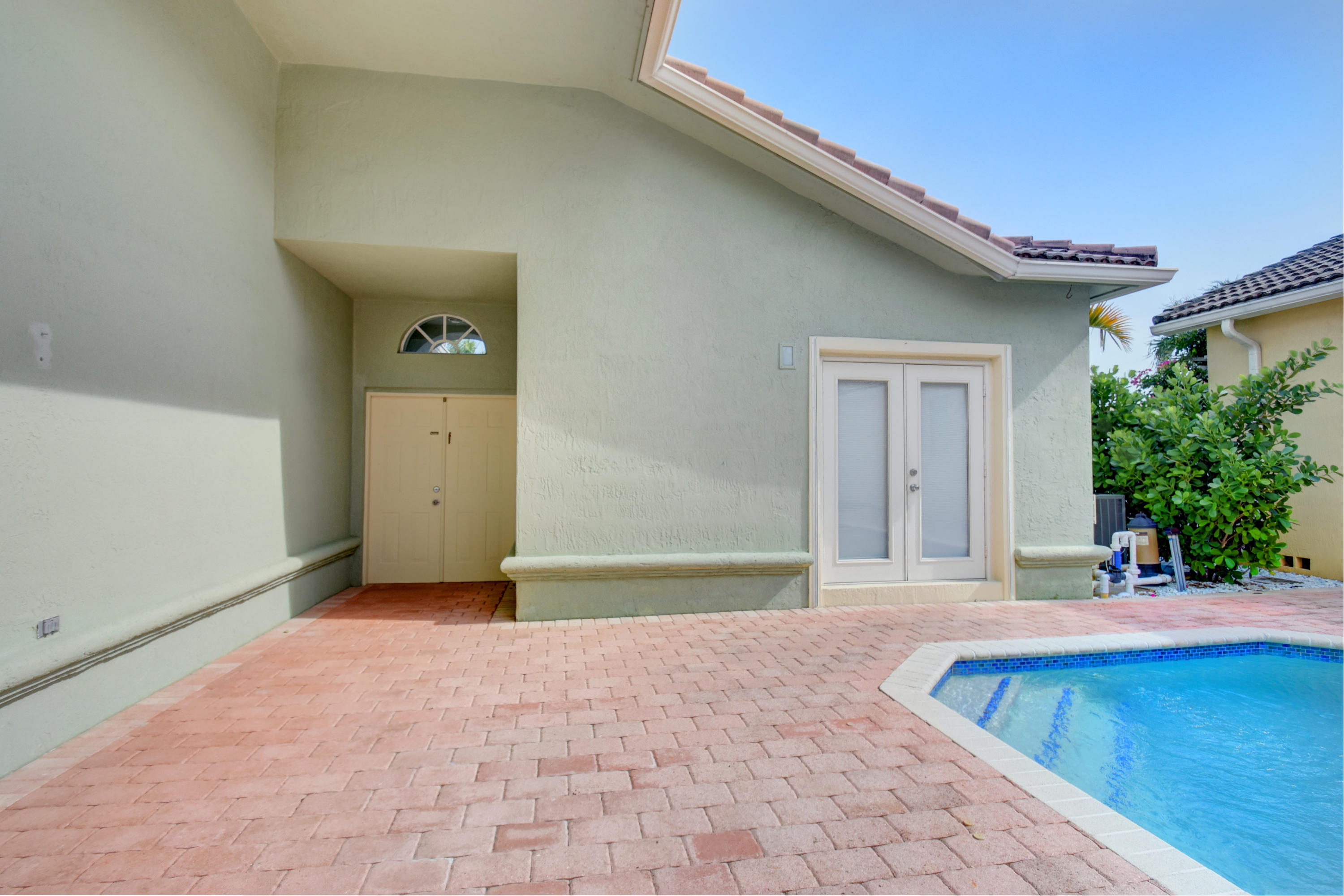 7201 Northwest Turtle Walk Boca Raton, FL 33487 - Photo 30 of 39 Double door entry to private courtyard