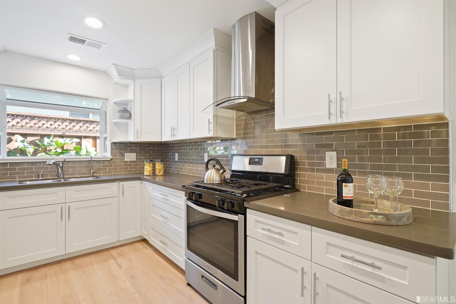 3143 Cadman Road Fremont, CA 94538 - Photo 15 of 54 a kitchen with granite countertop white cabinets and white appliances
