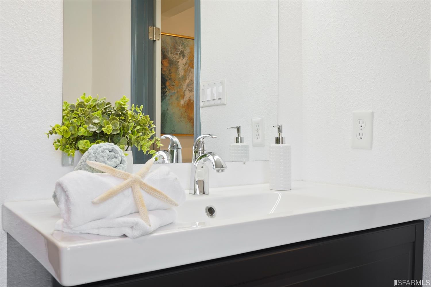 3143 Cadman Road Fremont, CA 94538 - Photo 21 of 54 a bathroom with a sink a vanity and a mirror