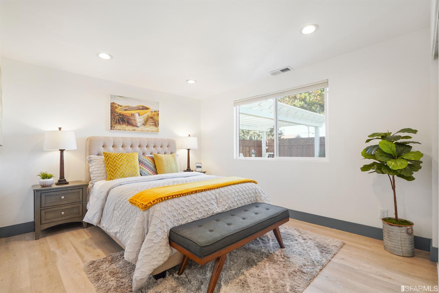 3143 Cadman Road Fremont, CA 94538 - Photo 24 of 54 a bedroom with a bed potted plant and a window