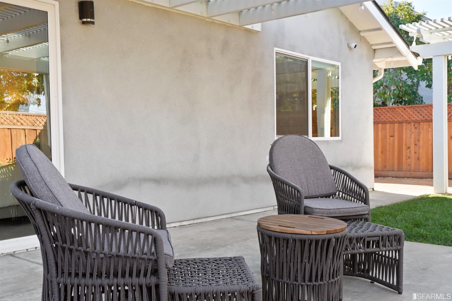 3143 Cadman Road Fremont, CA 94538 - Photo 44 of 54 a view of a chairs and table in back yard of a house