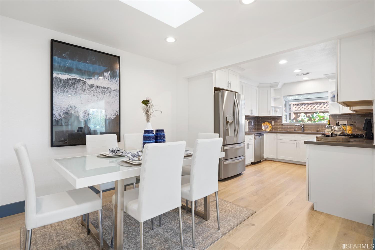 3143 Cadman Road Fremont, CA 94538 - Photo 7 of 54 a kitchen with a dining table chairs and refrigerator