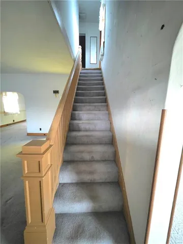 an empty room with a empty space and a window