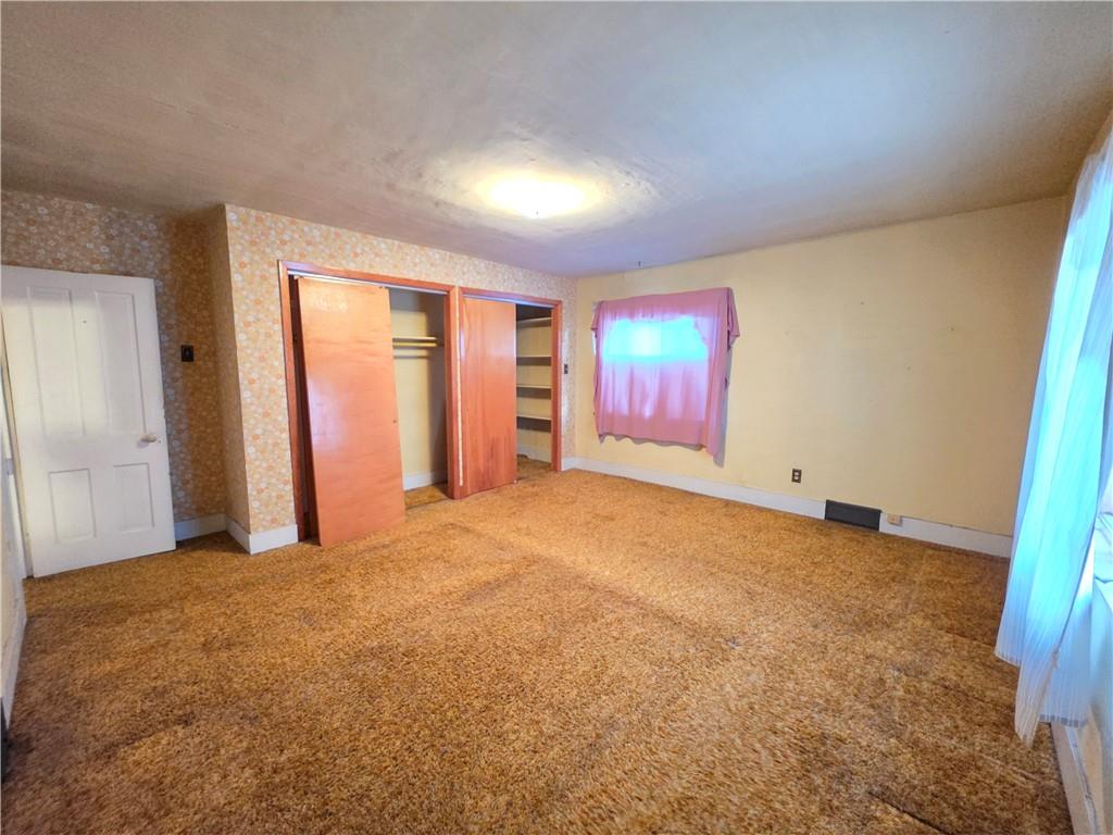 63 West Main Street, Unit 73 Yatesboro, PA 16263 - Photo 19 of 38 an empty room with windows