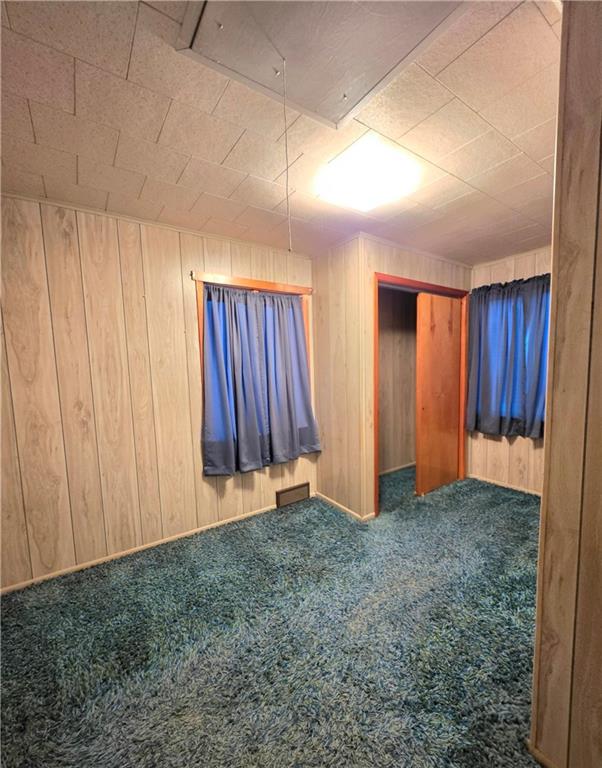 63 West Main Street, Unit 73 Yatesboro, PA 16263 - Photo 21 of 38 a view of an empty room with wooden walls