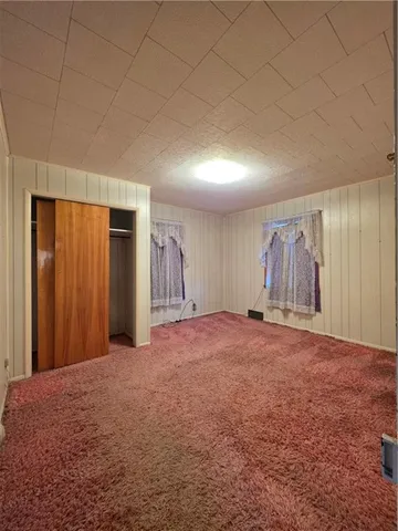 a bathroom with a shower and a sink