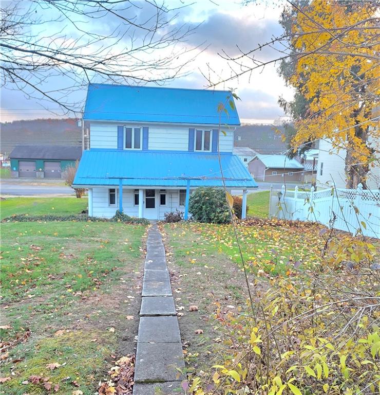 63 West Main Street, Unit 73 Yatesboro, PA 16263 - Photo 35 of 38 a front view of a house with a yard