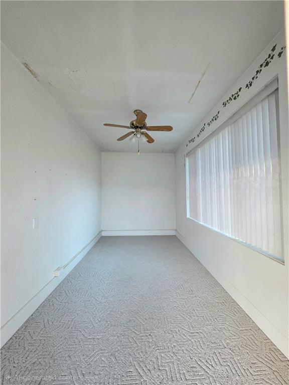 63 West Main Street, Unit 73 Yatesboro, PA 16263 - Photo 6 of 38 a view of a livingroom with a ceiling fan and window