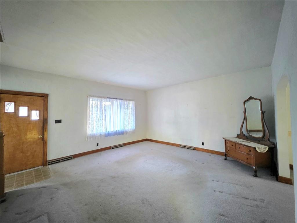 63 West Main Street, Unit 73 Yatesboro, PA 16263 - Photo 9 of 38 an empty room with windows