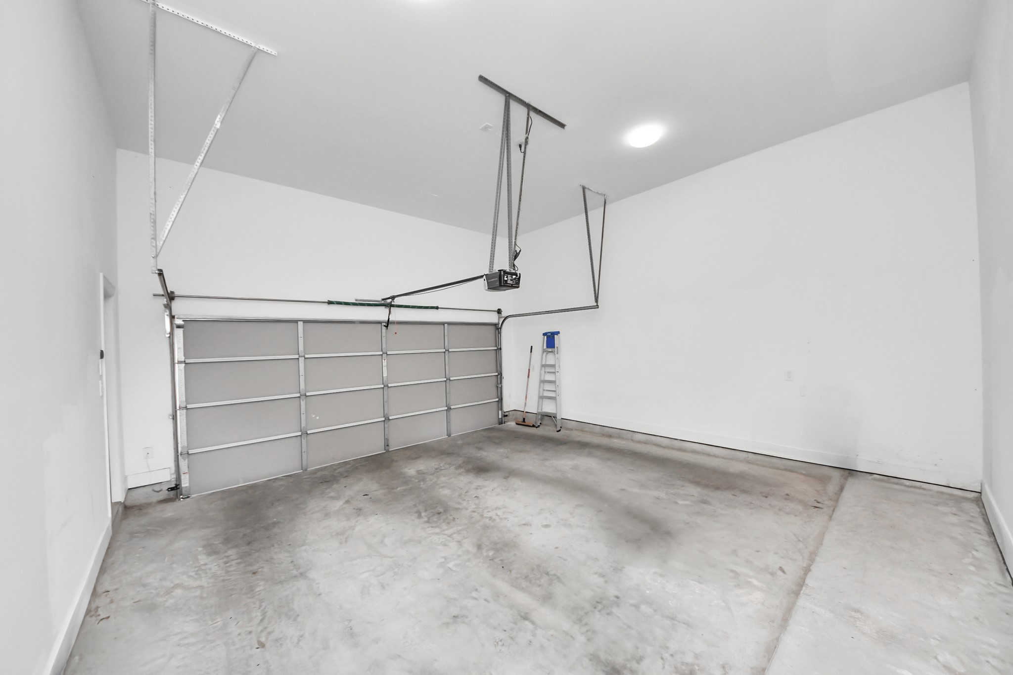 1628 West 24th Street Houston, TX 77008 - Photo 34 of 41 This spacious two-car attached garage features extra tall ceilings, perfect for maximizing storage and functionality.