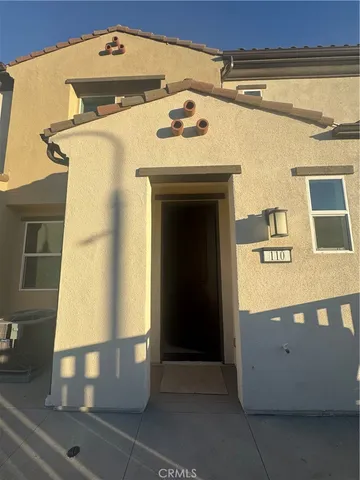 a front view of a building with garage