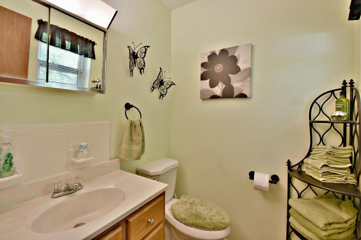 6100 McNeely Road Corryton, TN 37721 - Photo 13 of 17 a bathroom with a sink mirror and toilet