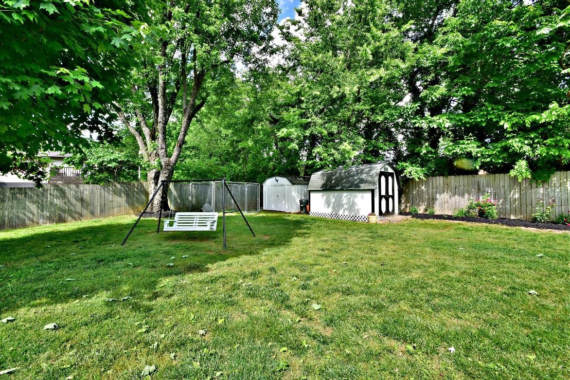 6100 McNeely Road Corryton, TN 37721 - Photo 17 of 17 a view of a park with a bench and a large tree