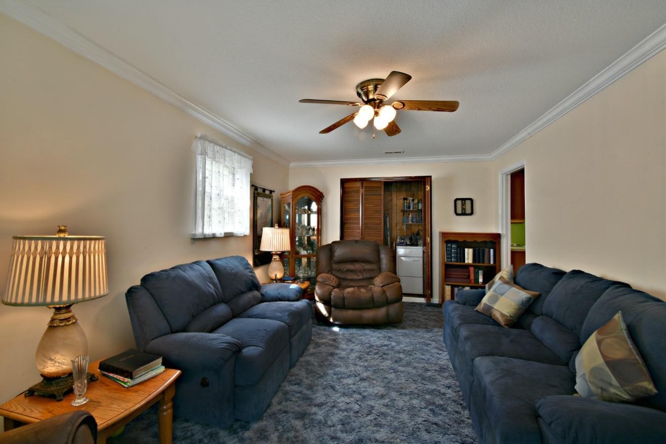 6100 McNeely Road Corryton, TN 37721 - Photo 9 of 17 a living room with furniture a fireplace and a window