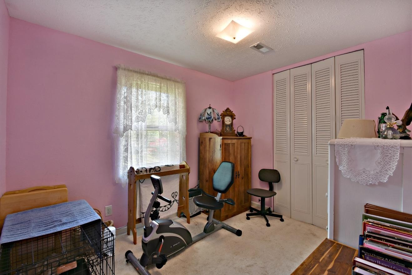 6100 McNeely Road Corryton, TN 37721 - Photo 10 of 17 a view of a workspace with furniture and a window