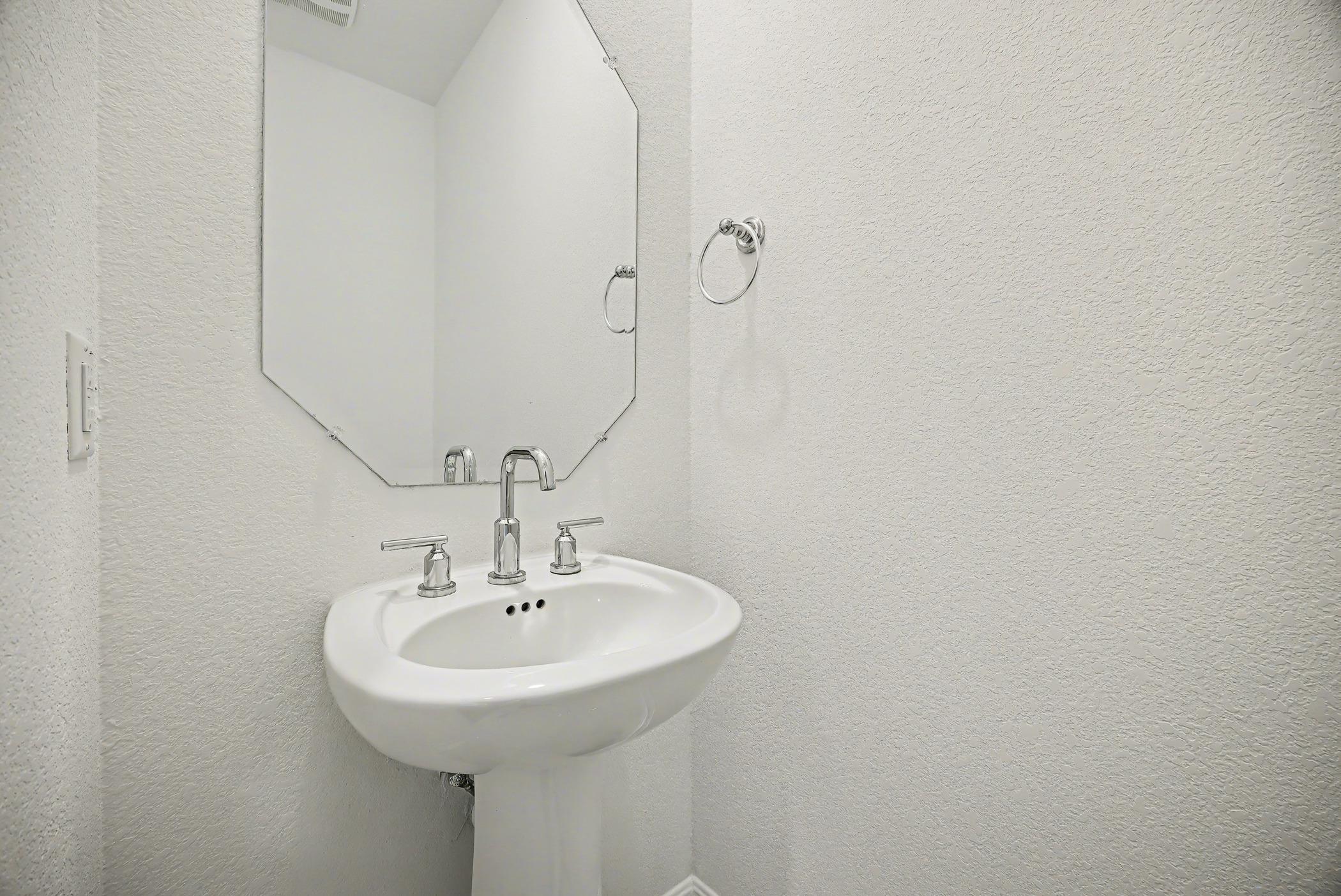 424 Spindrift Lane Leander, TX 78641 - Photo 11 of 26 a bathroom with a sink and a mirror