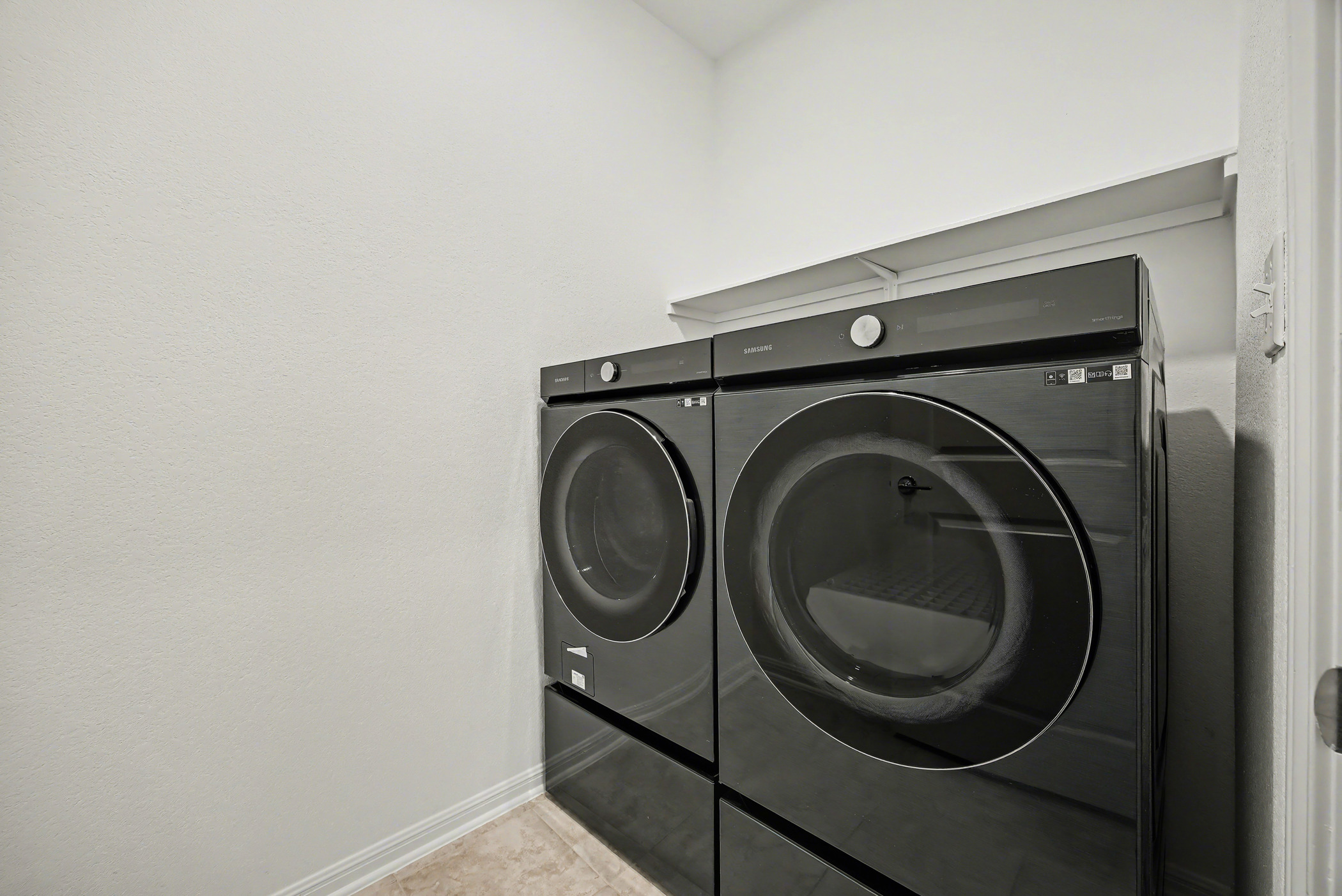 424 Spindrift Lane Leander, TX 78641 - Photo 12 of 26 a utility room with dryer and washer