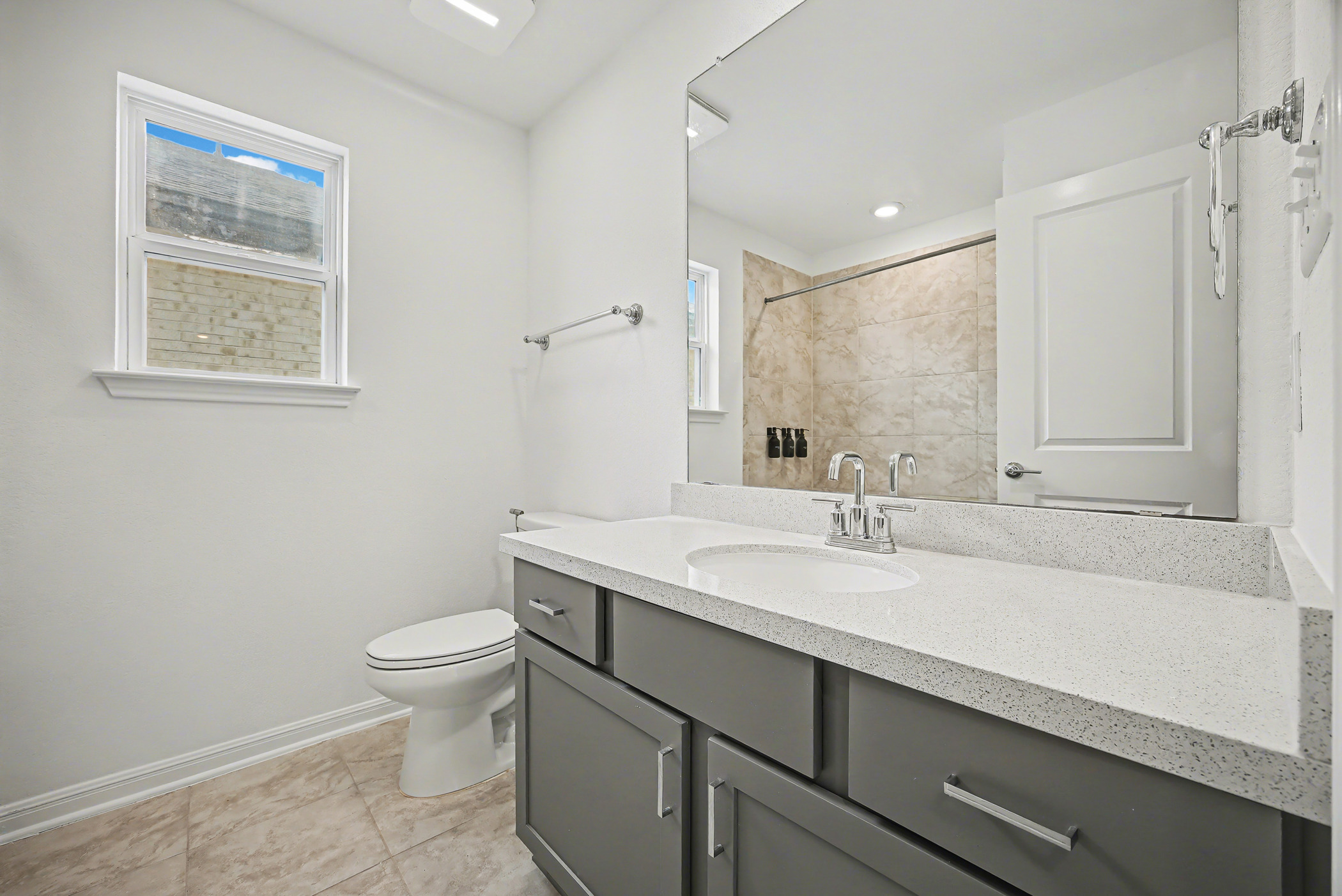 424 Spindrift Lane Leander, TX 78641 - Photo 19 of 26 a bathroom with a sink toilet and vanity