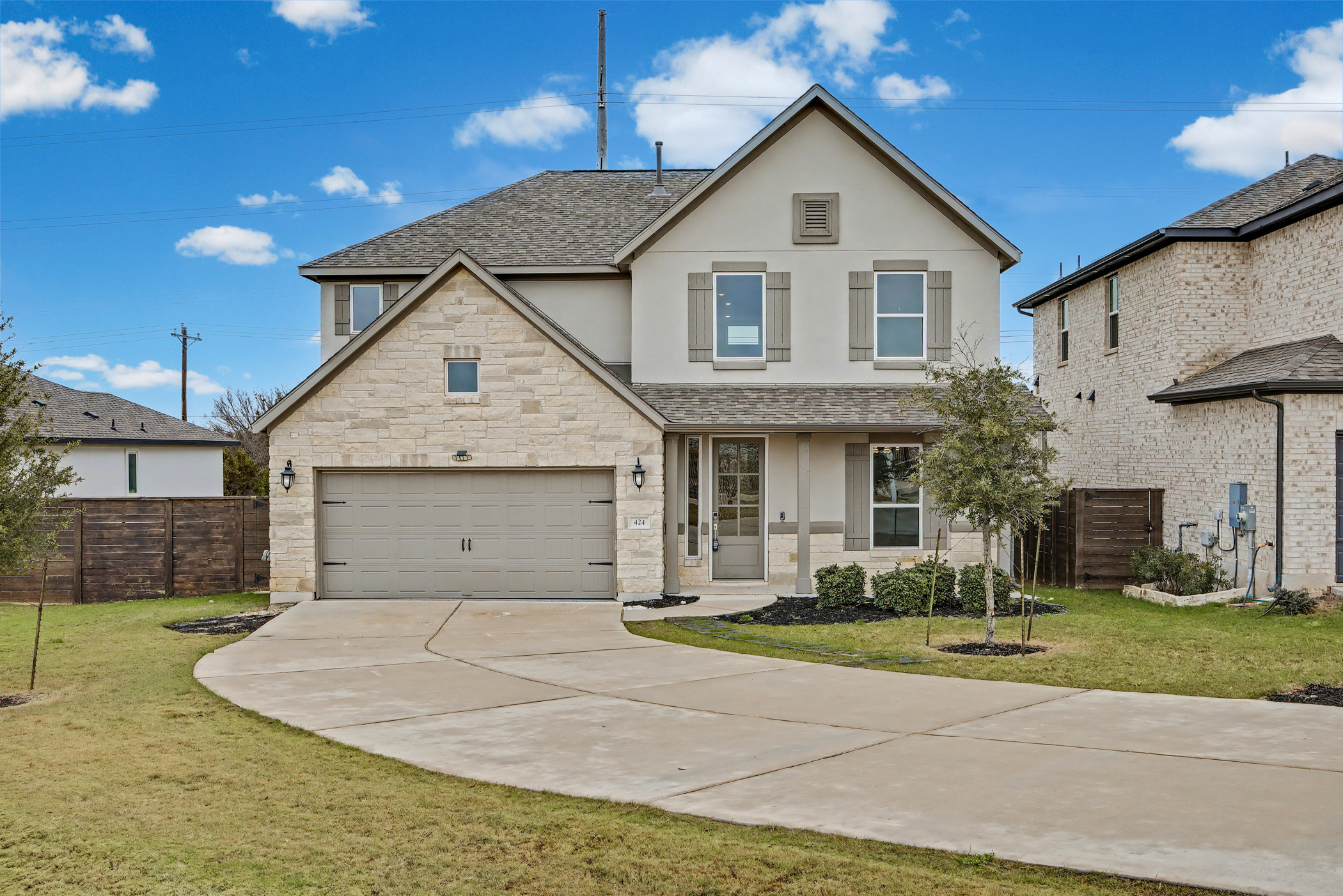 424 Spindrift Lane Leander, TX 78641 - Photo 26 of 26 a front view of a house with a yard and garage