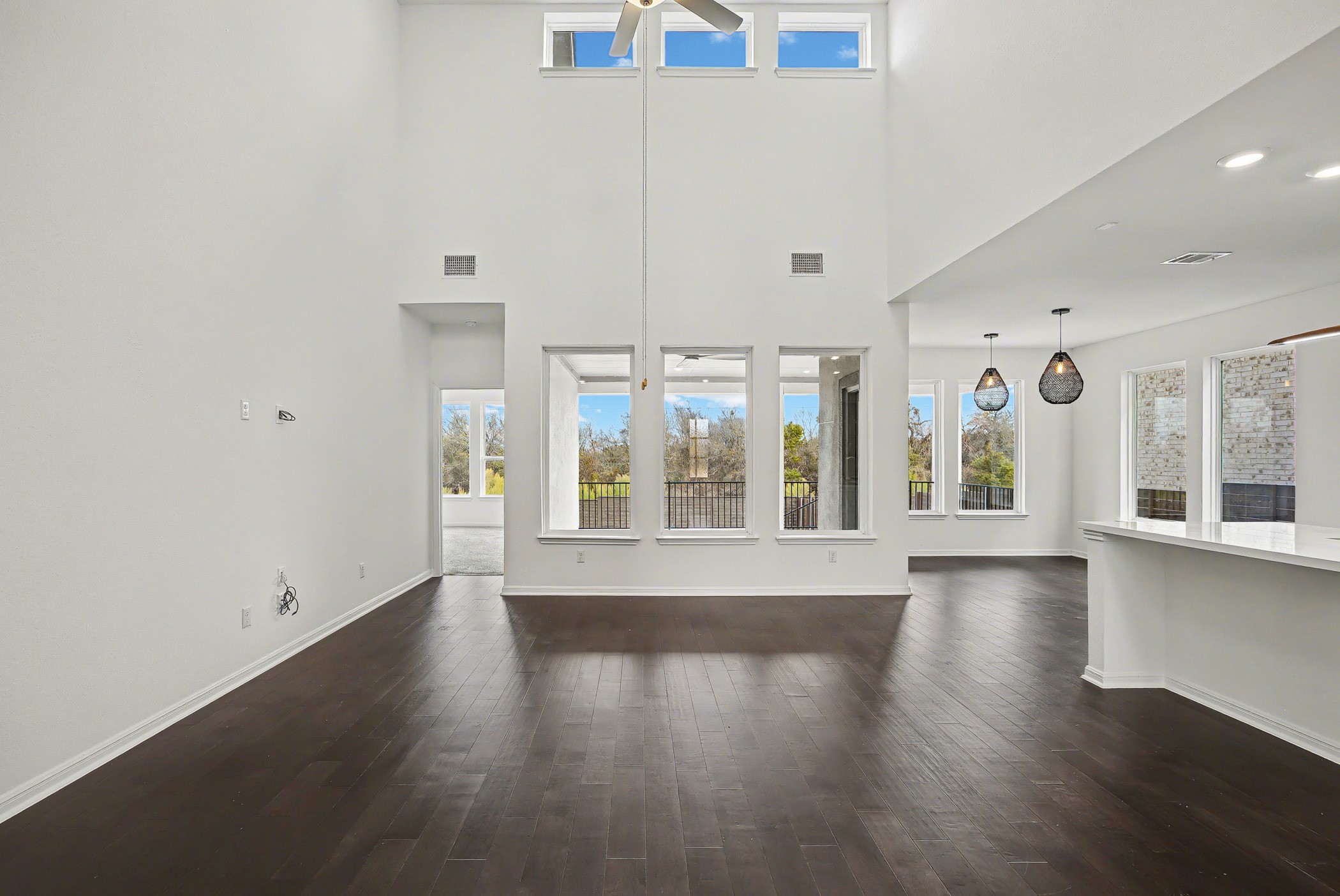 424 Spindrift Lane Leander, TX 78641 - Photo 4 of 26 an empty room with wooden floor and windows