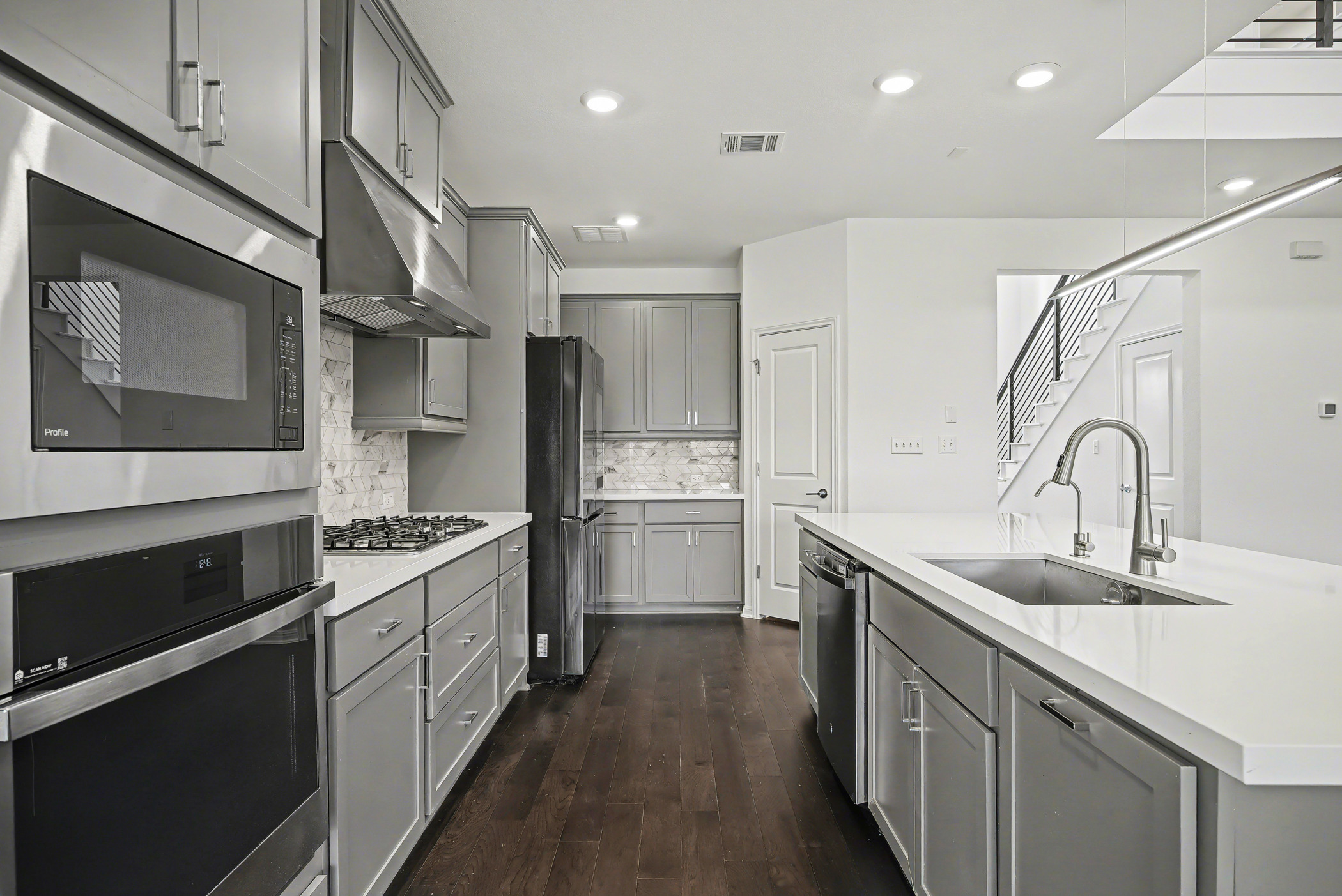 424 Spindrift Lane Leander, TX 78641 - Photo 8 of 26 a kitchen with stainless steel appliances granite countertop a sink stove and refrigerator