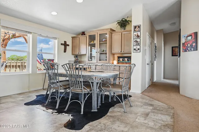 a dining room with furniture and entryway