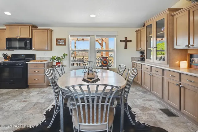 a dining room with furniture a window and kitchen view