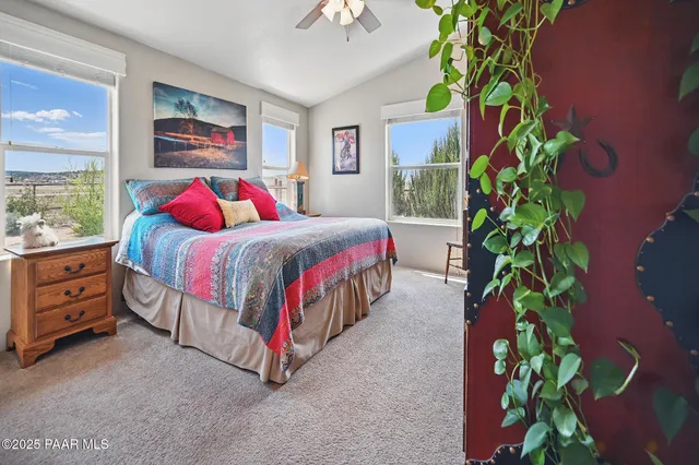 a bedroom with a bed plant and a window