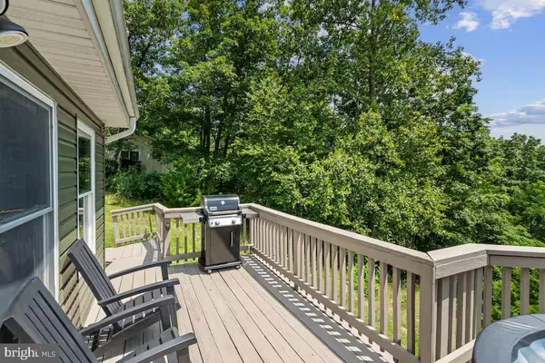 a view of balcony with furniture and trees