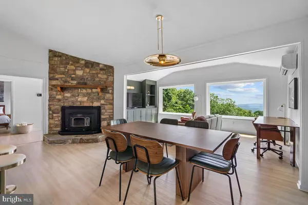 a view of a dining room with furniture window and outside view