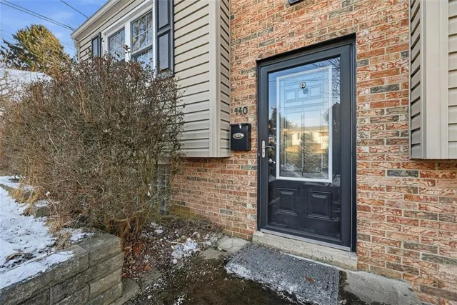 a view of a brick house with a large window