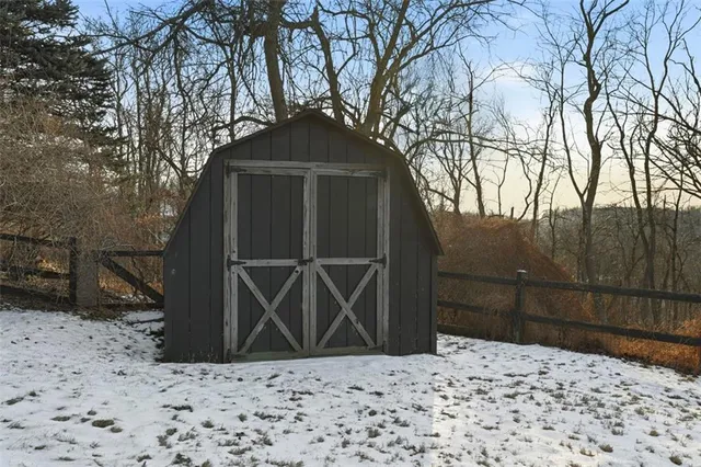 an aerial view of a house with a mountain