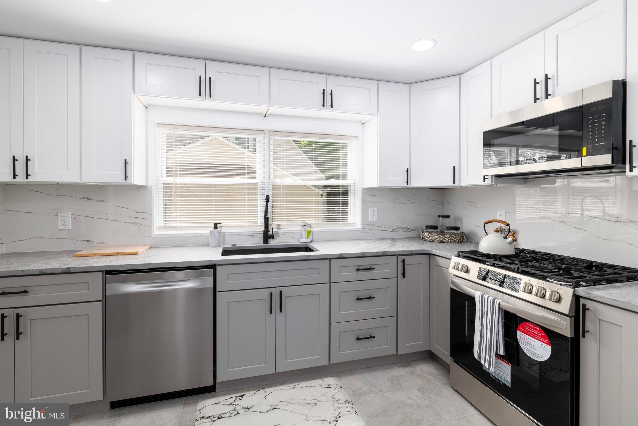 404 Crescent Road Hatboro, PA 19040 - Photo 7 of 18 a kitchen with stainless steel appliances granite countertop a sink and a stove