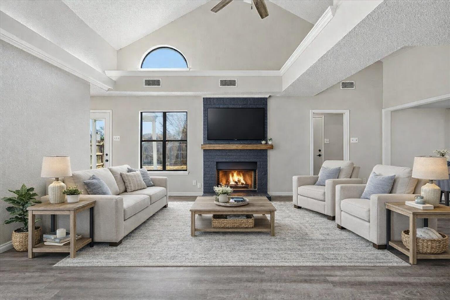 a living room with furniture and a fireplace