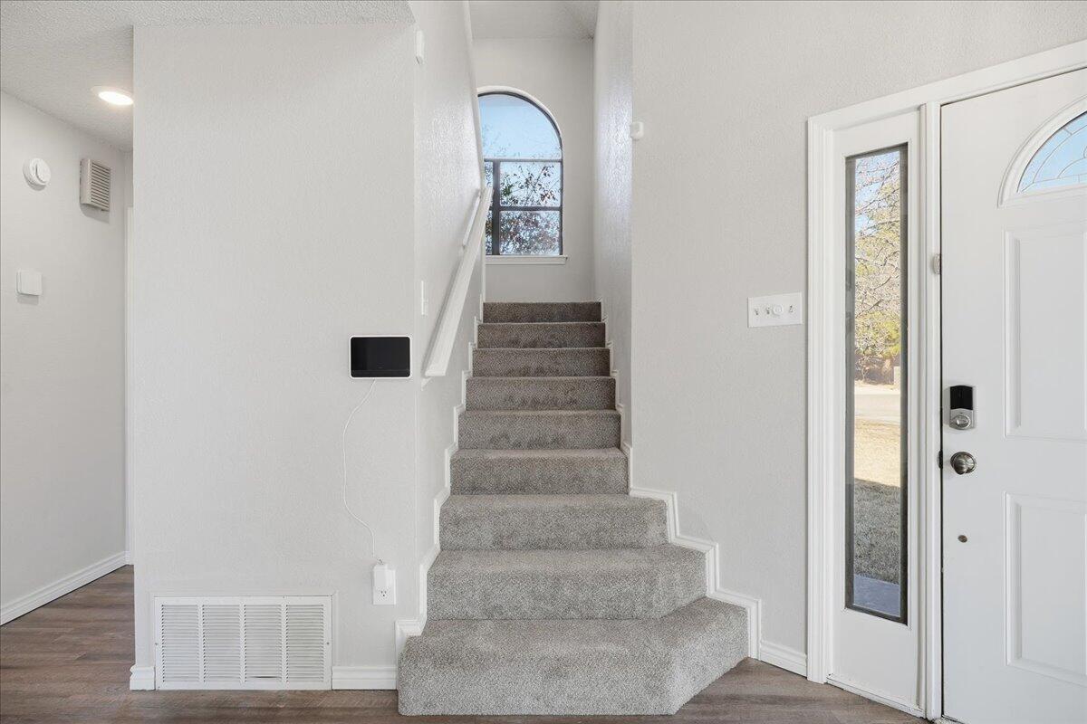 2301 92nd Street Lubbock, TX 79423 - Photo 22 of 30 a view of an entryway with stairs