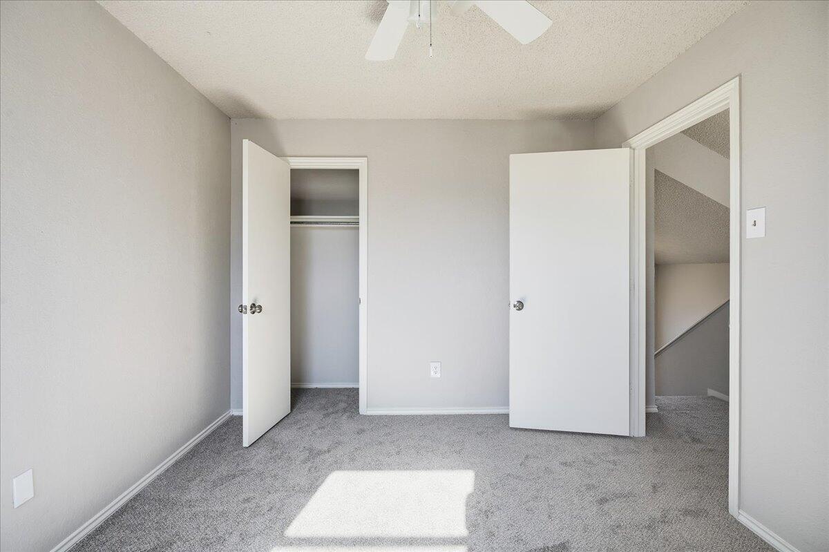 2301 92nd Street Lubbock, TX 79423 - Photo 26 of 30 a view of an empty room with closet and a window