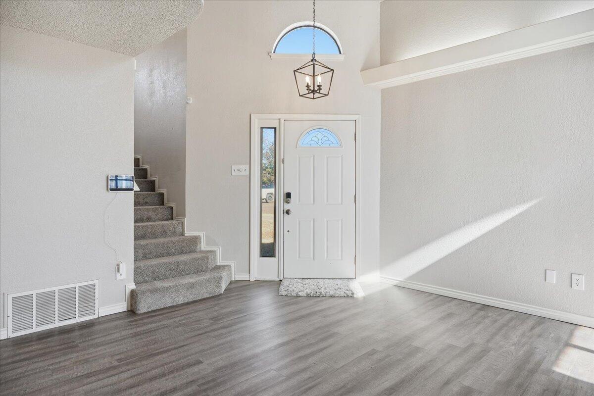 2301 92nd Street Lubbock, TX 79423 - Photo 5 of 30 a view of entryway with wooden floor