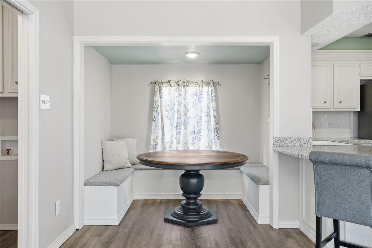 2301 92nd Street Lubbock, TX 79423 - Photo 7 of 30 a room with a table and chairs