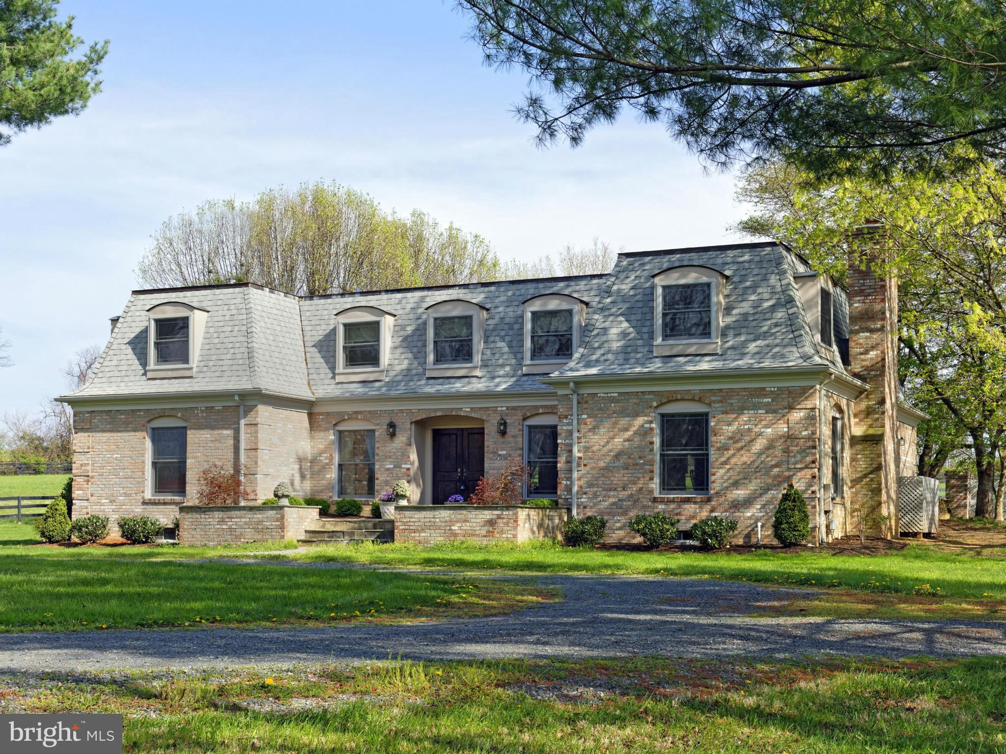 21230 St Louis Road Middleburg, VA 20117 - Photo 2 of 30 Open flagstone courtyard at the front entrance