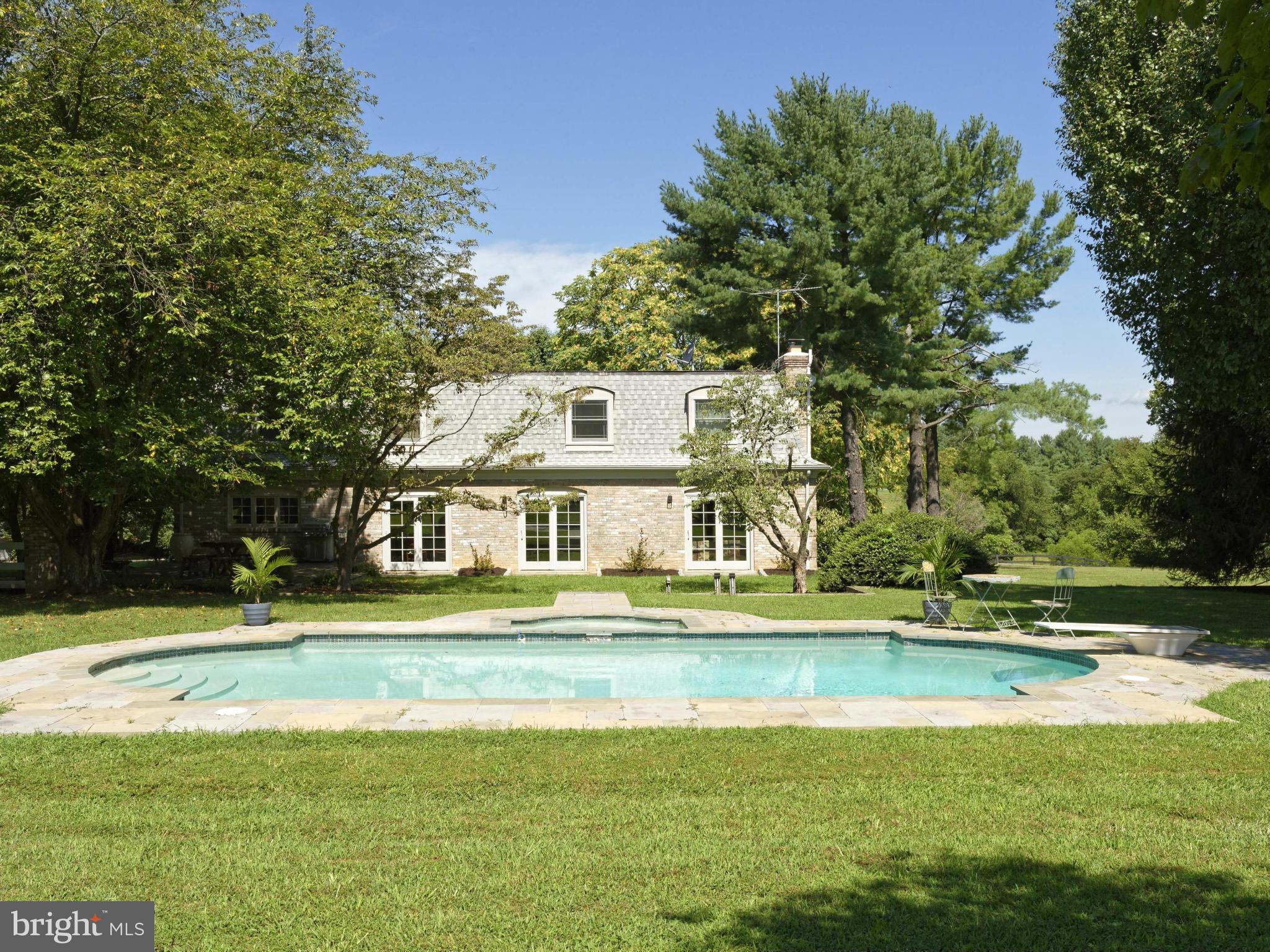 21230 St Louis Road Middleburg, VA 20117 - Photo 24 of 30 View across the pool to the back of the house