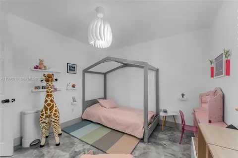 a bedroom with bed and a window