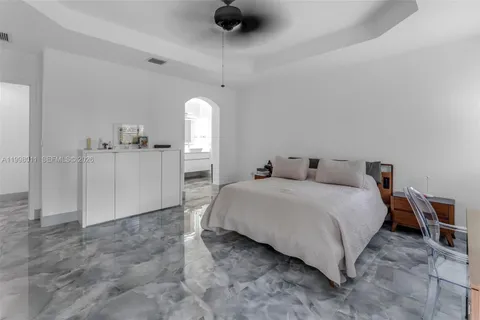 a bedroom with a bed and cabinets