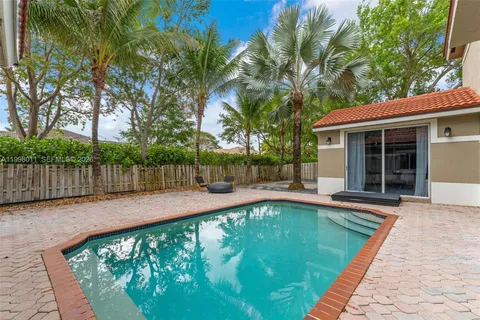 a swimming pool with wooden fence