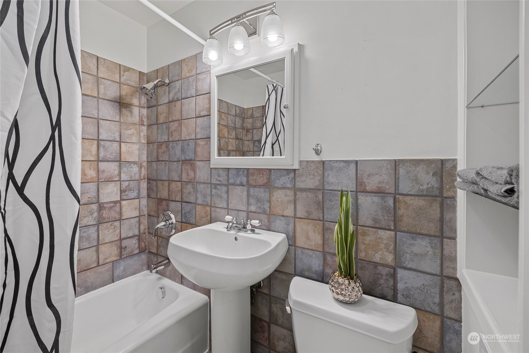 9734 31st Avenue Southwest Seattle, WA 98126 - Photo 11 of 29 a bathroom with a sink toilet and shower
