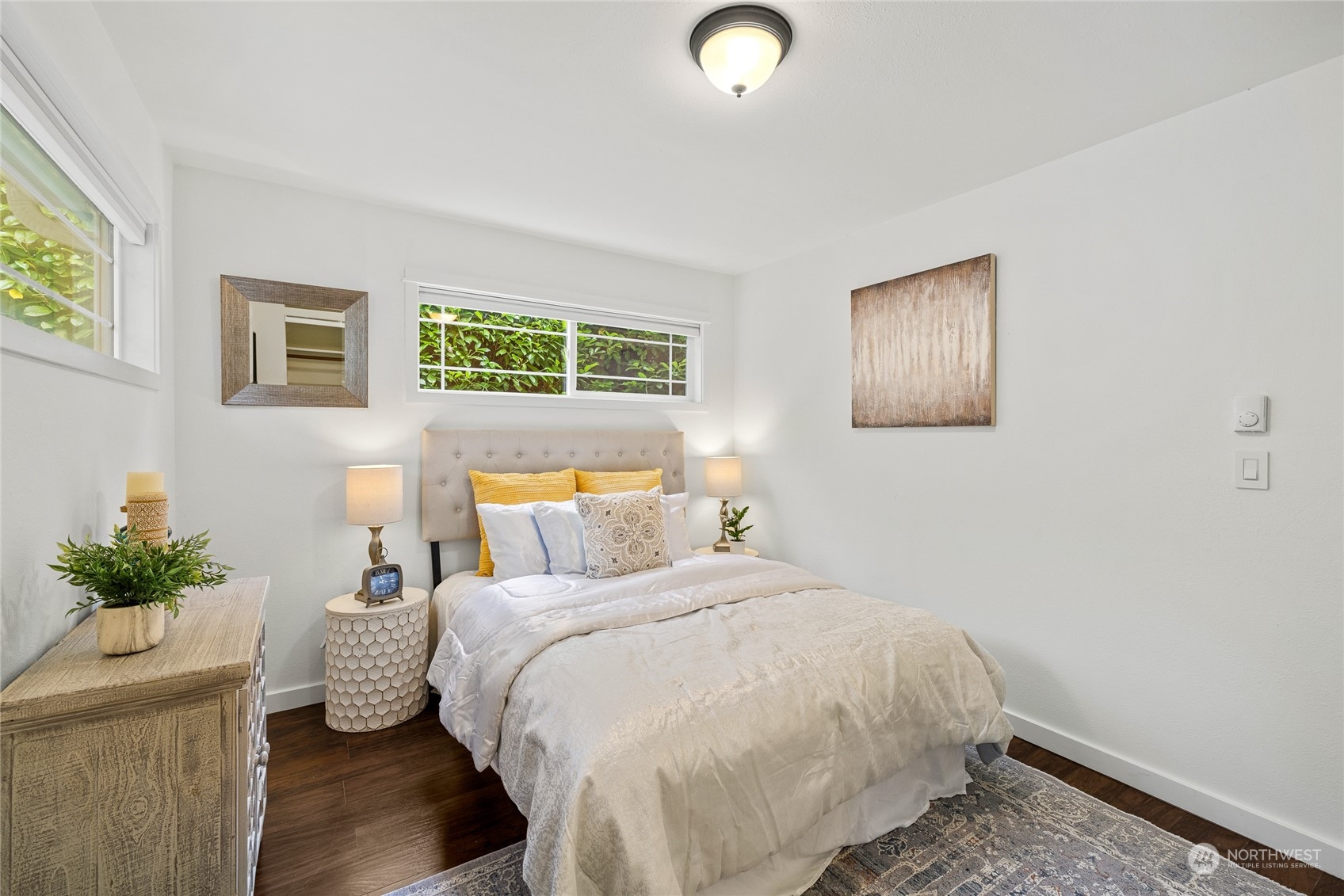 9734 31st Avenue Southwest Seattle, WA 98126 - Photo 12 of 29 a bedroom with a bed and a potted plant
