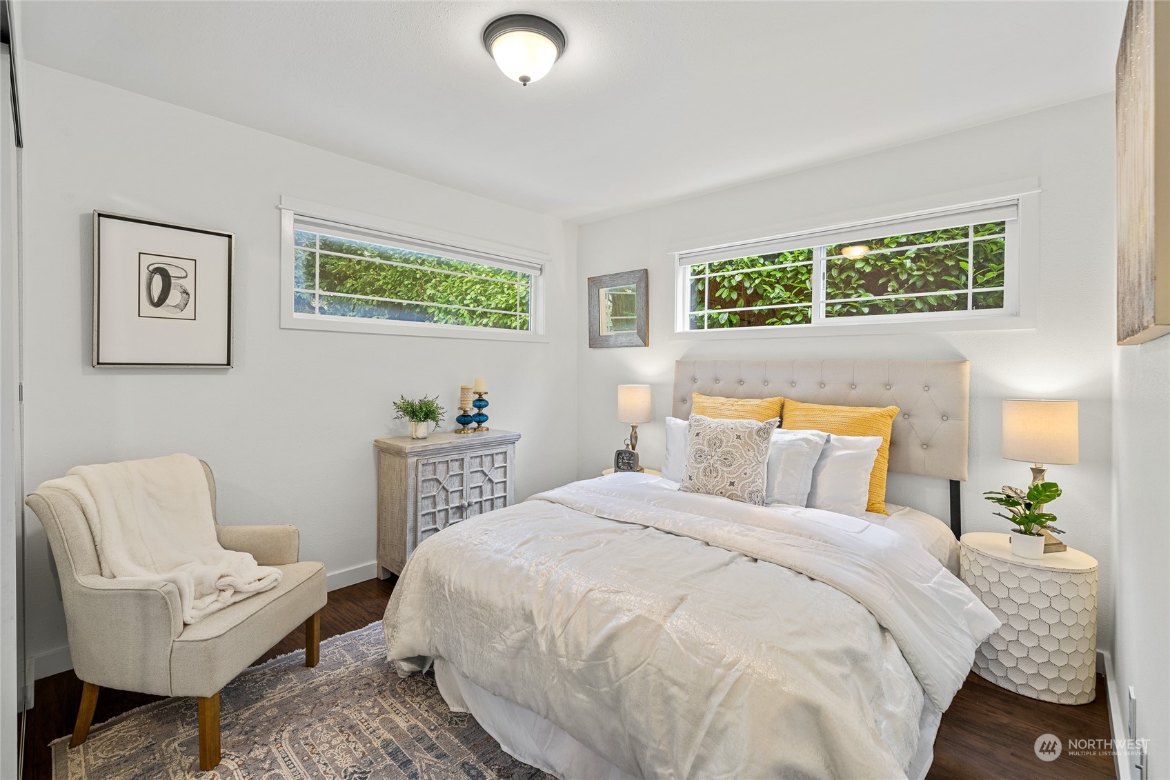 9734 31st Avenue Southwest Seattle, WA 98126 - Photo 13 of 29 a bed room with a bed and a chair
