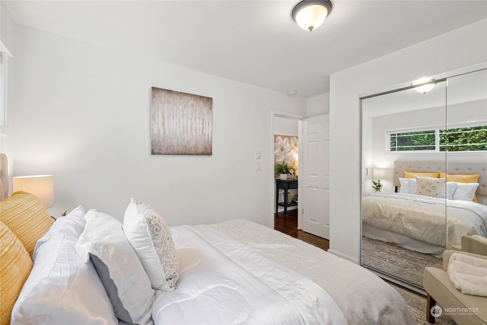 9734 31st Avenue Southwest Seattle, WA 98126 - Photo 14 of 29 a bedroom with a bed and a lamp